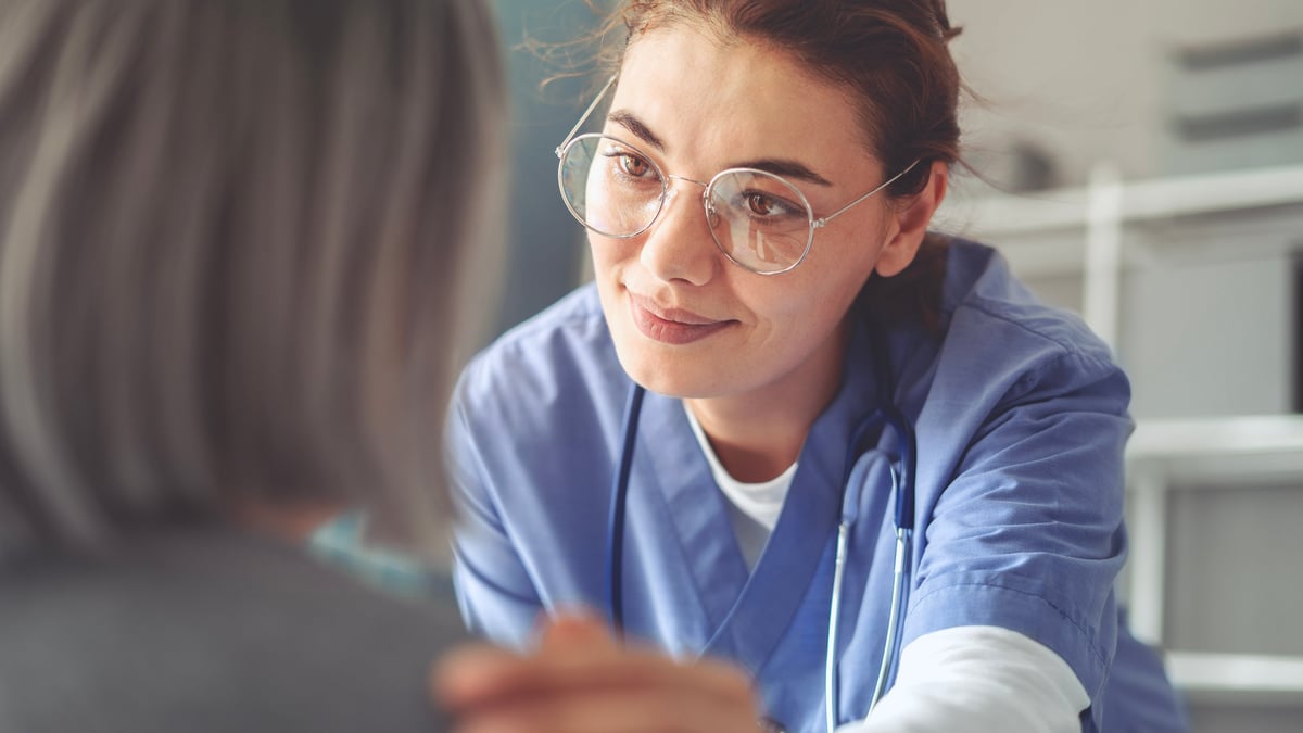 Healthcare worker with elderly patient